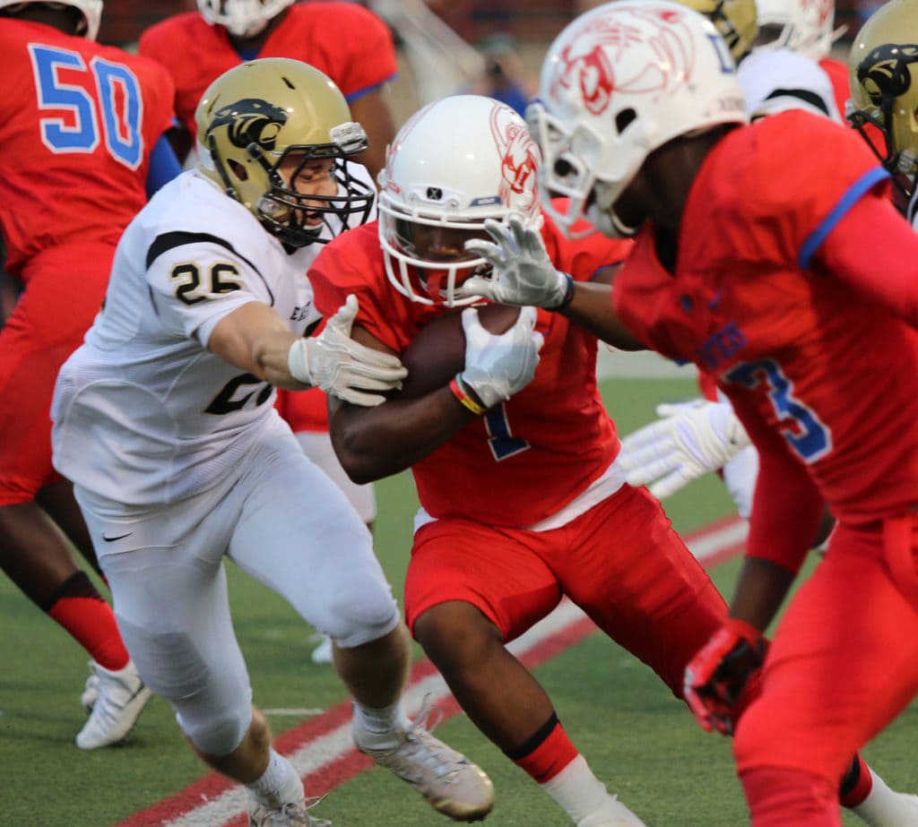 Running Back Tre Siggers pushes past a Plano East defender on the corner during Friday night’s 36-32 win. (Jose Sanchez/Duncanville High School)