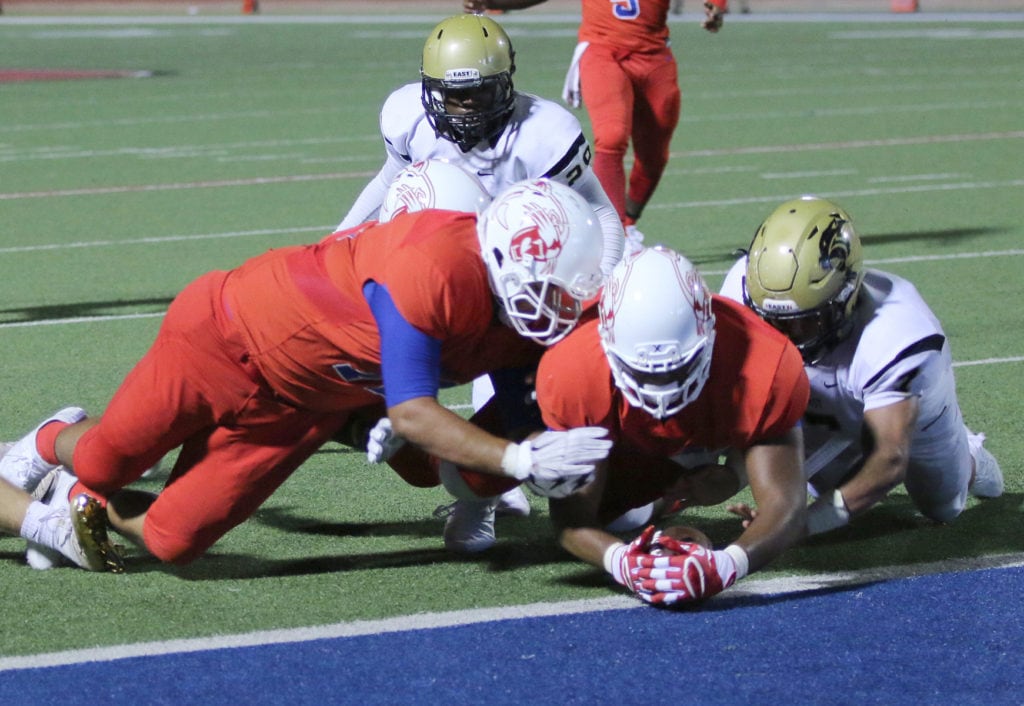 Panther quarterback Jalen Nelson takes the snap and pushes into the endzone for a touchdown in there 36-32 win over Plano East. (Jose Sanchez/Duncanville High School)