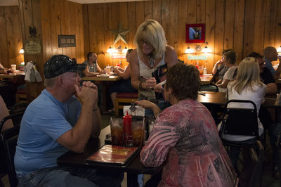 Cast Iron Grill patrons place their meal order. 