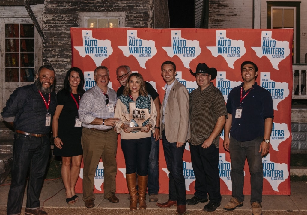 Jamie Tinsley proudly holds the award forFull-Size CUV of Texas. She is surrounded by members of the Texas Auto Writers Association Board of Directors. The CX-9 was judged the best vehicle in its category at the Texas Truck Rodeo.