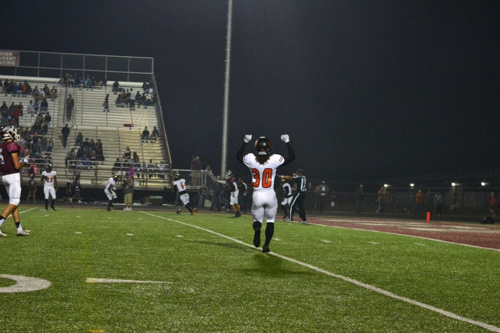 Lancaster High School defensive back Dimitri Miles (30, foreground) and Taiyoun Nichols (6, background), linebacker janarieon Reynolds (23, background) react to a Red Oak pass being broken-up near the goal line October 21, 2016. The Lancaster Tigers beat the Hawks 46-7 at Red Oak's Billy Goodloe Stadium. (Photo by Alexis Thames/Tiger Student Media}