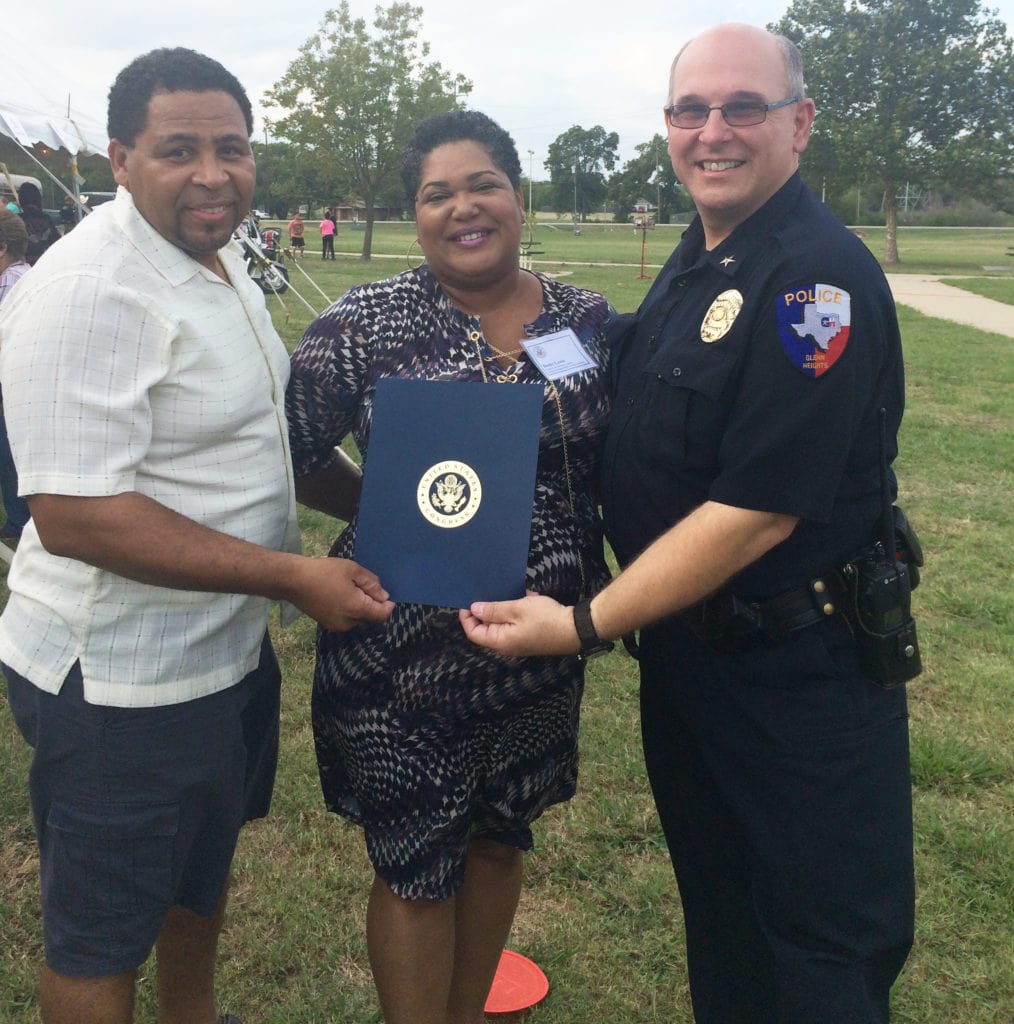 Mayor Leon Tate, Congressional Constituent Liaison Becky Lewis and Chief Phillip Prasifka poses for a photo during a recent National Night Out community event. Lewis presented a letter of appreciation on behalf of the Honorable Eddie Bernice Johnson to the Glenn Heights Department.