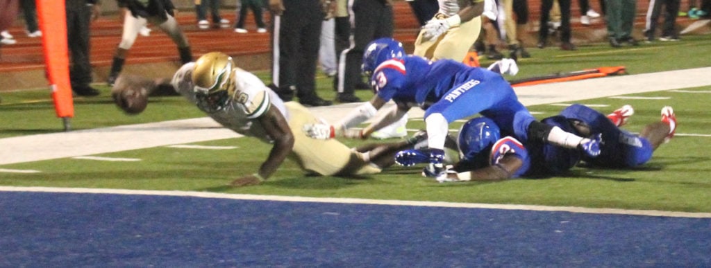 2015 DeSoto Quarterback Tristan Wallace scrambles for the first touchdown of the game in 2015.