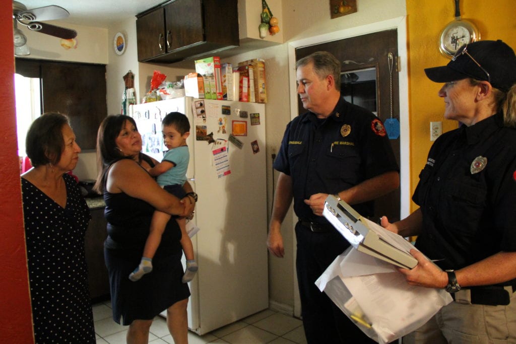 Duncanville Firefighters install smoke alarms in the home of local resident Juan Andrade.