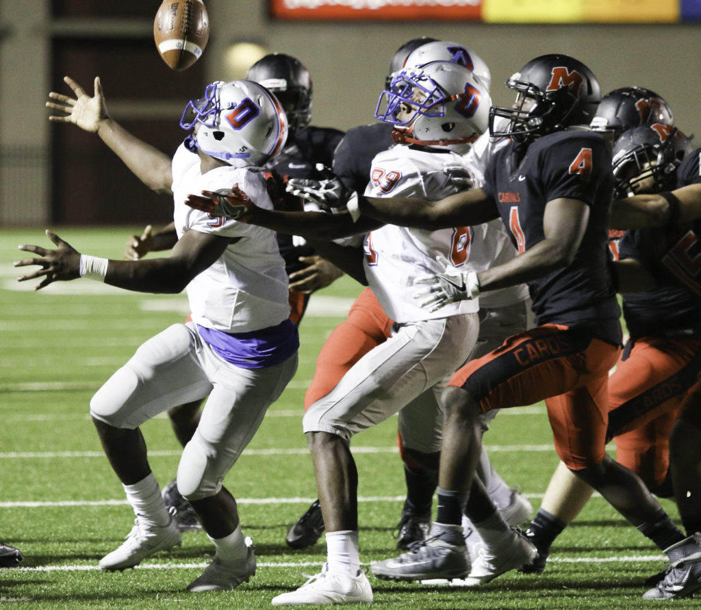 Duncanville fights for the ball as MacArthur fumbles early in the game near their own 20 yard line. (Reece Rodriguez/Duncanville High School)