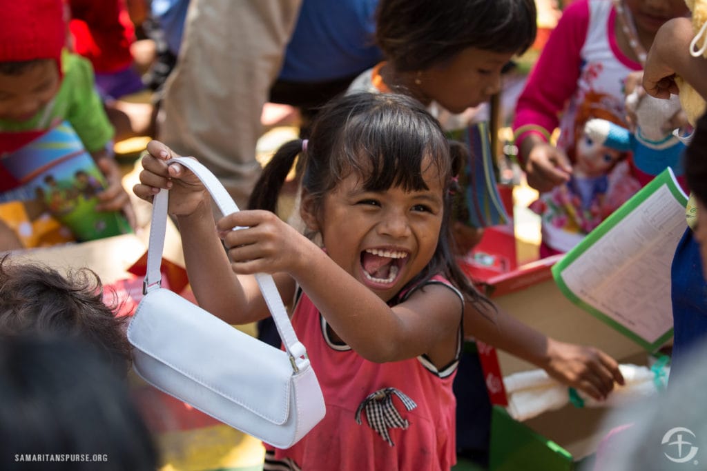 Morning shoebox distribution through Jesus Loves You Church in Thmey village, Svay Rieng province, Cambodia.