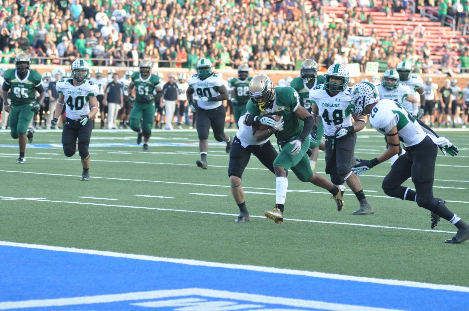 Despite serious leg injury Dontre Wilson runs a 76 yard touchdown pass in the third quarter of the 2012 DeSoto vs Southlake Carroll matchup. (File Photo)