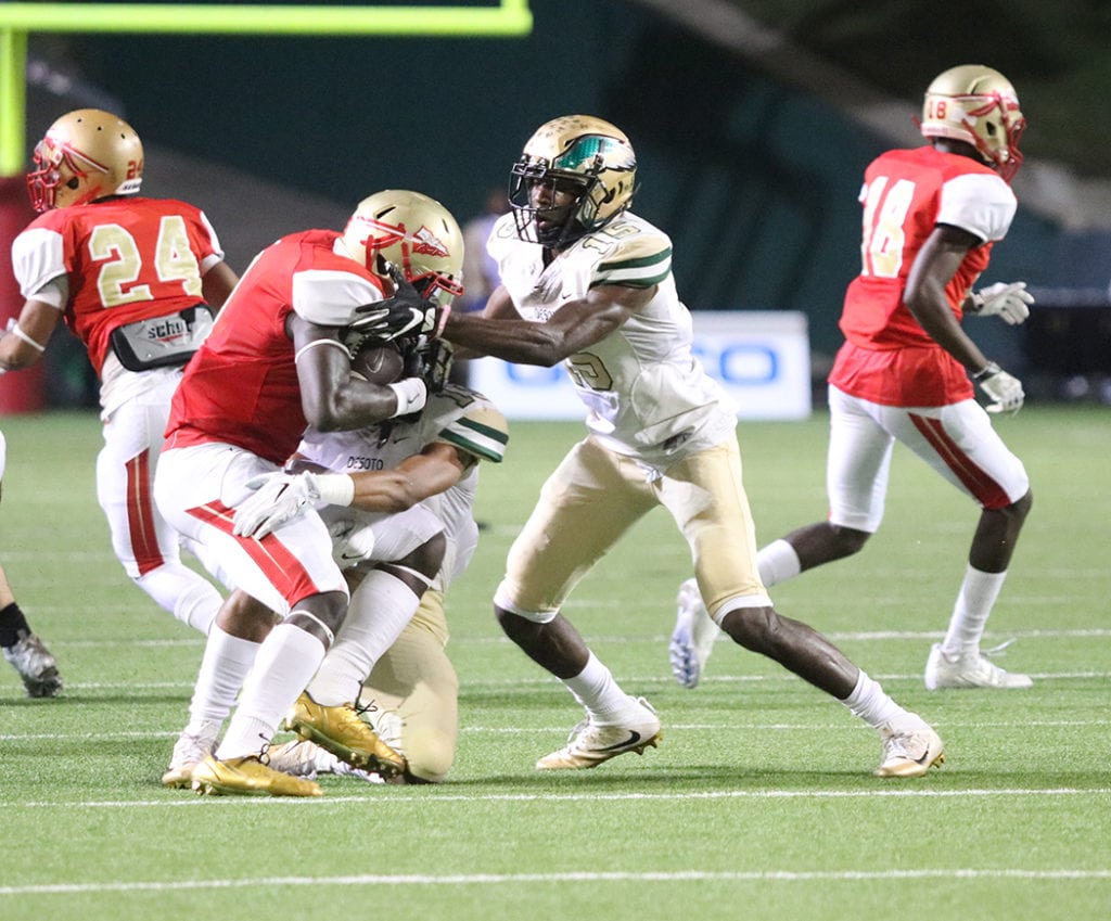 Orion Smith dashes the Warriors' hope as he brings down the South Grand Prairie Quarterback behind the line of scrimmage. The Eagles held the Warriors too only 131 yards on the ground. (Marifer Vega/DeSoto High School)