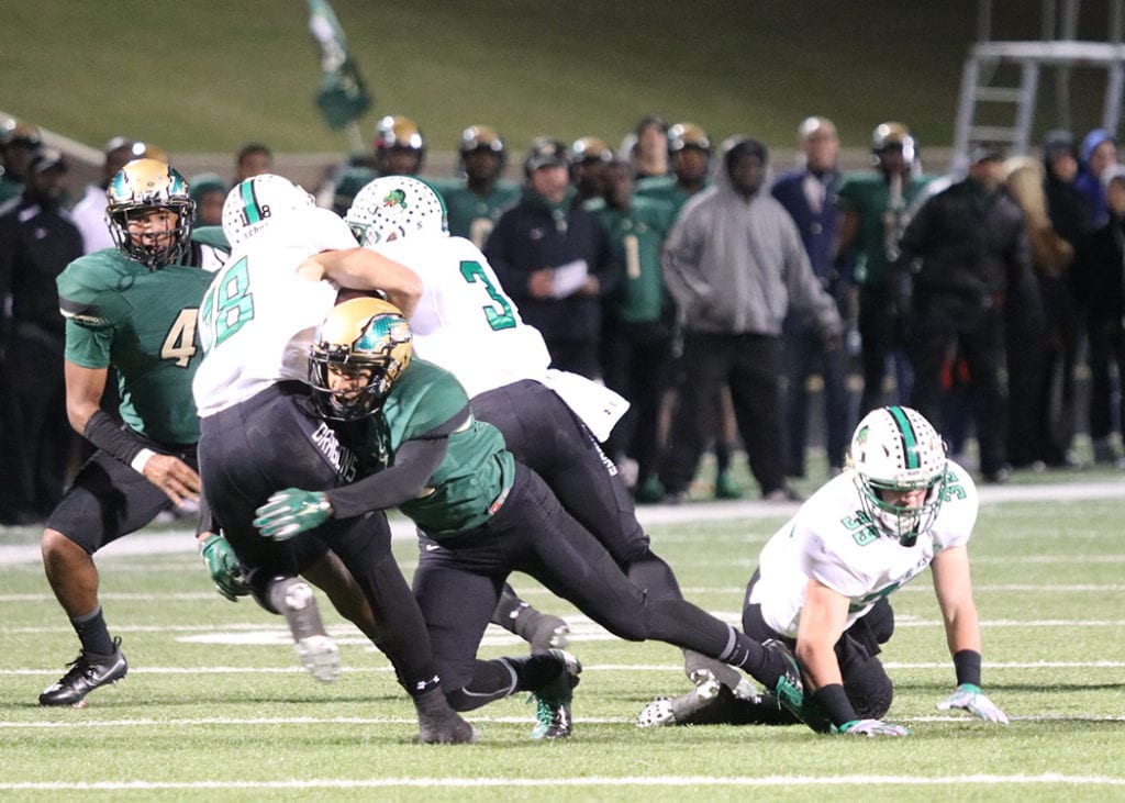 After Southlake scored early in the first half, the Eagle defense rose to the occasion forcing thee Dragons to kick from their own three yard line. It was all downhill from there as defensive players like Phillip Jones tackling the Southlake quarterback. (Photo by Marifer Vega/DeSoto High School)