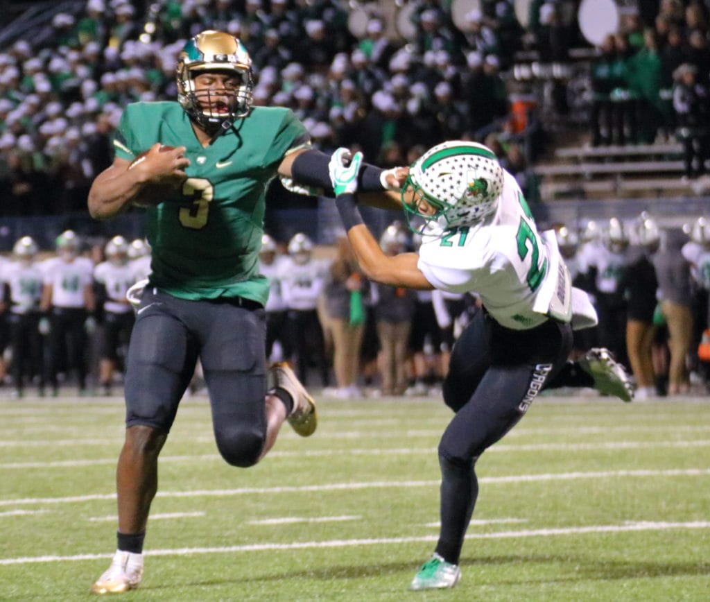 Quarterback Shawn Washington caps a scoring drive by adding two points at the end of the first half to give the Eagles a 29-23 lead. Early in the second half the Eagles scored three more times en route to a convincing win. (Photo by Santos Salazar/DeSoto High School)