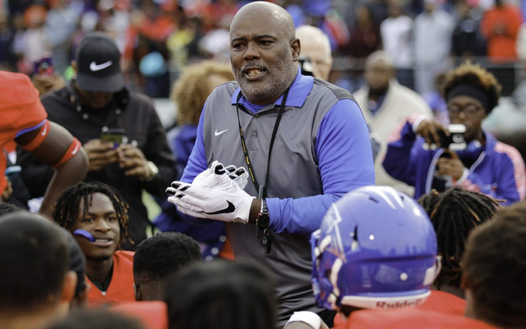 Coach Reginald Samples addresses the team after their victory over Arlington Bowie. (Photo by Dillon Clarke/Duncanville High School)