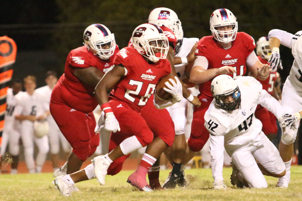 Junior, Donald “Tray” Gamble runs against the Bishop Lynch Friar defense on Friday, September 23, 2016. The Falcons won this match 28-21.