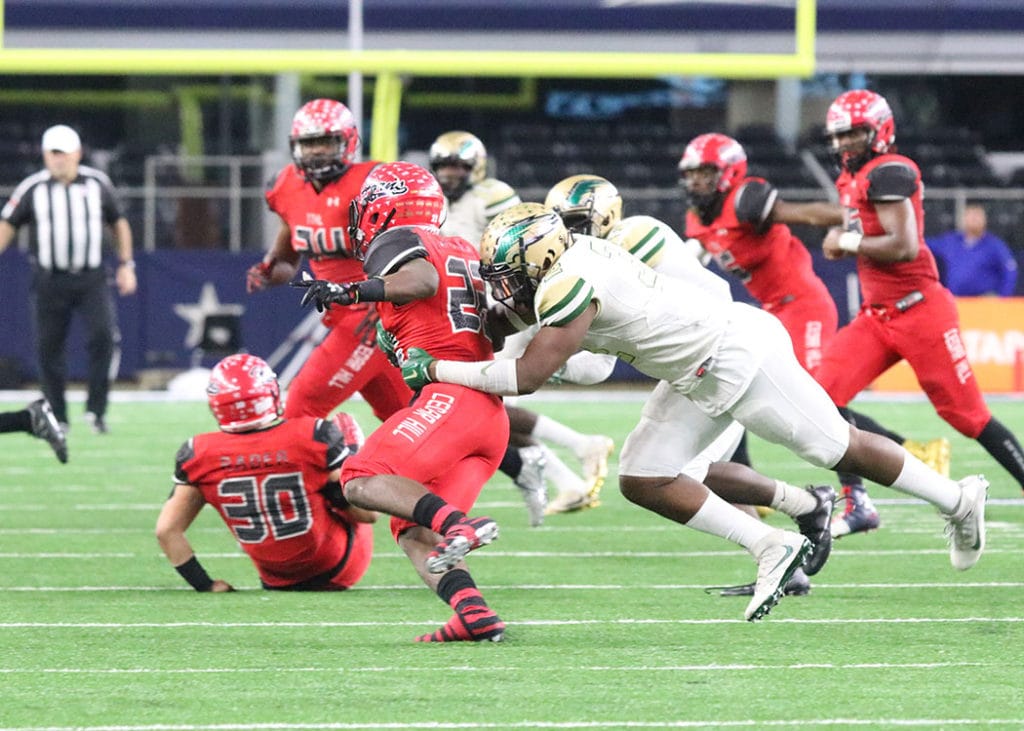 Tyler Jackson brings down Cedar Hill Running Back Jihad Thomas for a loss. (Marifer Vega/DeSoto High School)