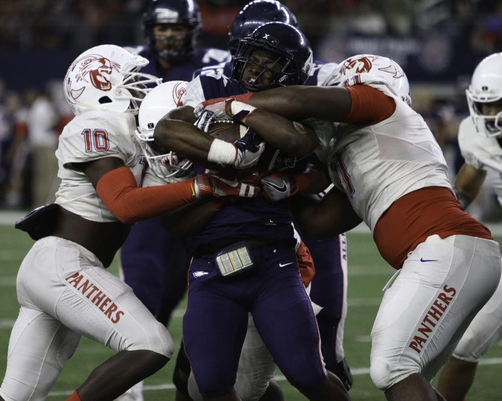 Dorian Williams assists on a Allen running stop. (Dillon Clarke/Duncanville High School)