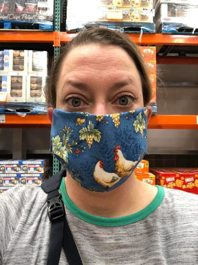 lady wearing face mask with roosters