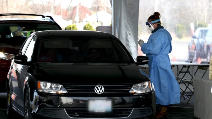 healthcare worker by car