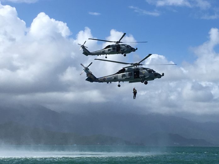 Justin Gifford in Navy helicopter