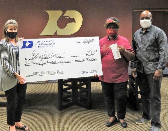 DeSoto Grant 1 DeSoto residents accept grant check
