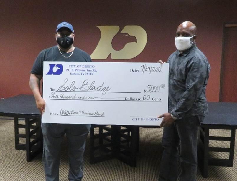 Solo Bladze receives grant check from DeSoto