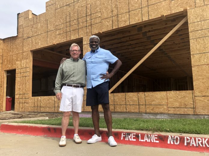 el primo's partners stand in front of renovations