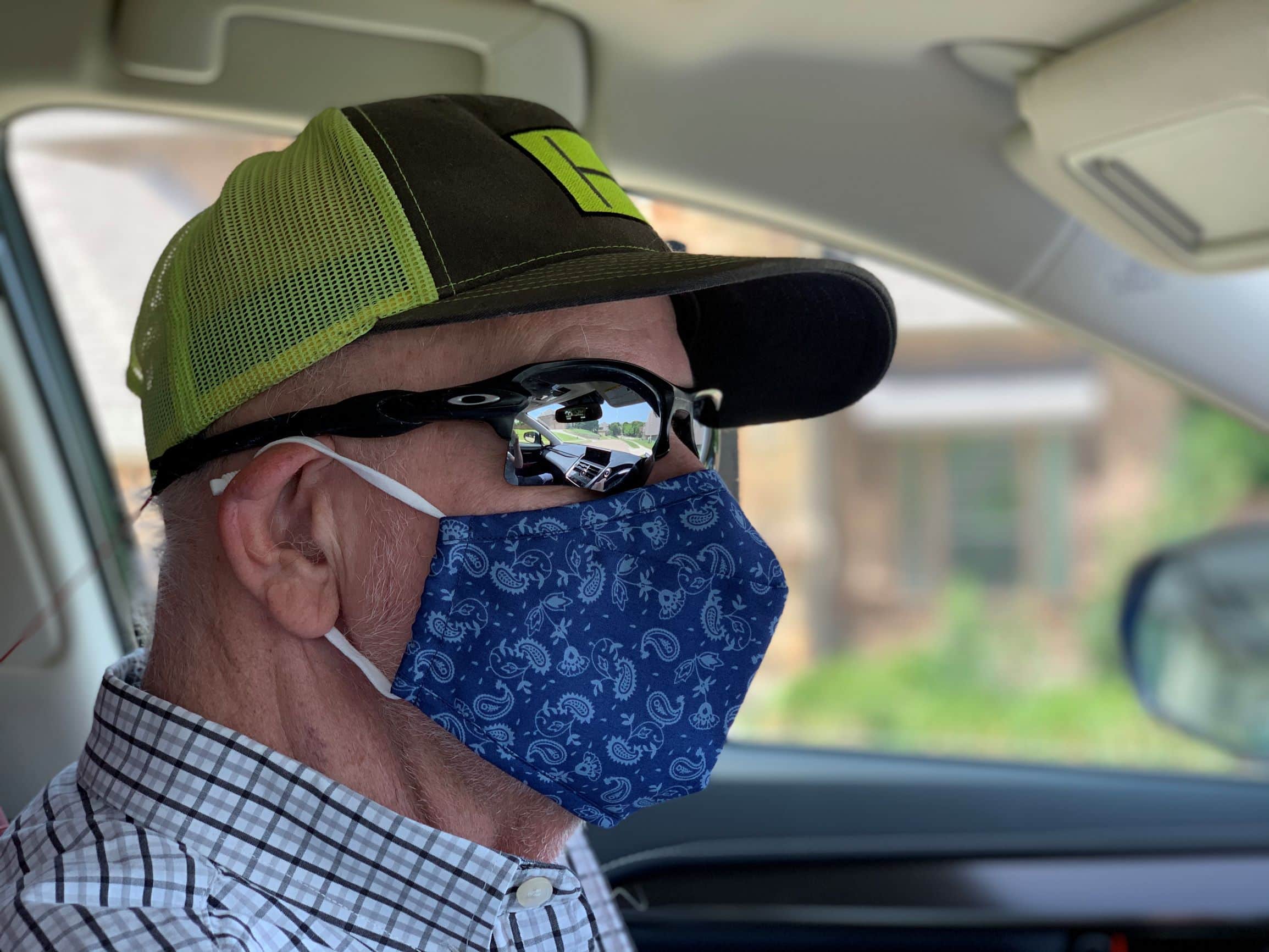 Man models face mask from Tie Bar