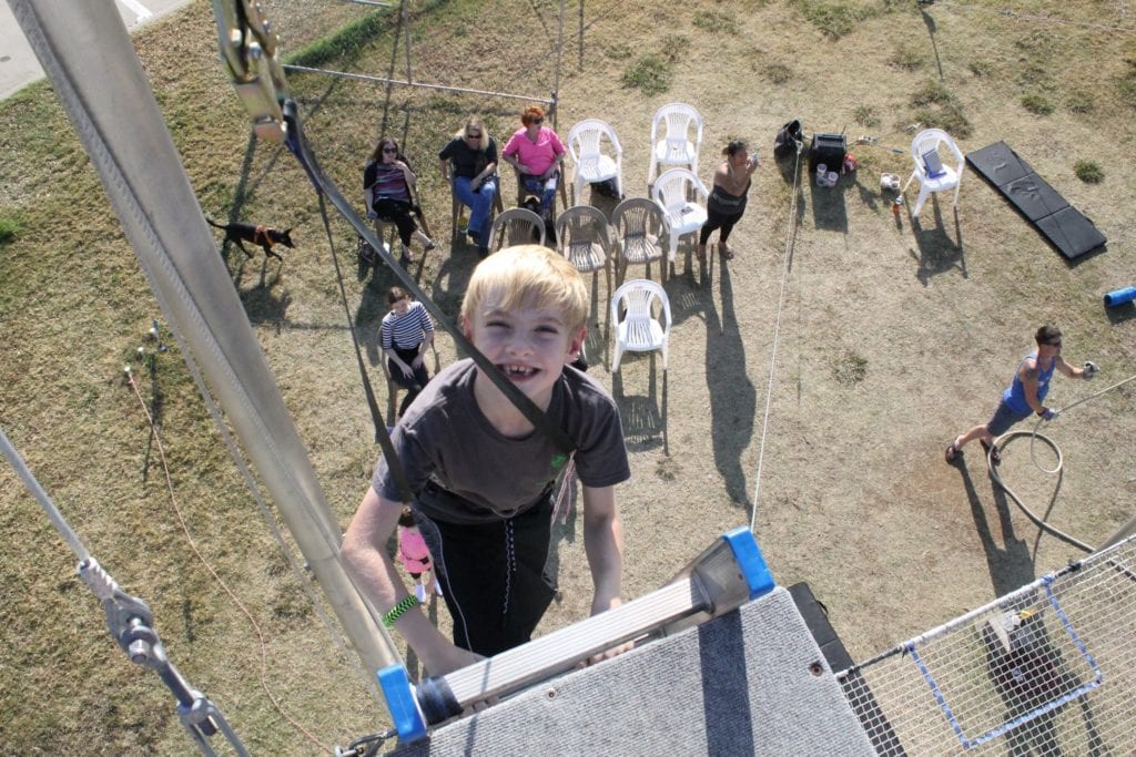 boy climbing ladder for trapeze