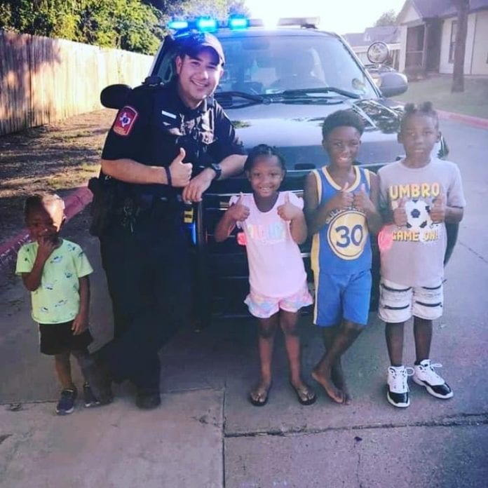 joseph urias poses with children