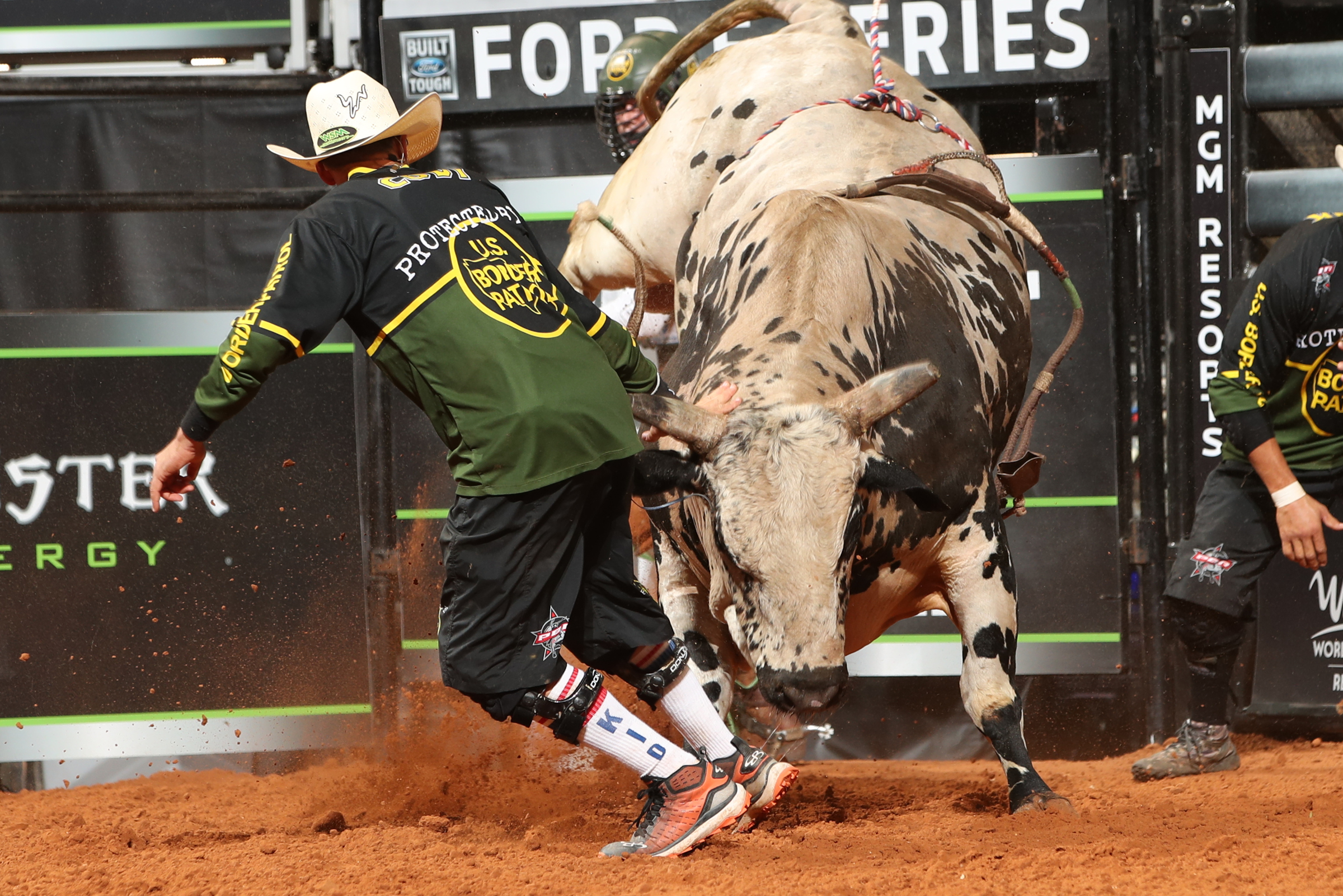 Rodeo clown and charging bull