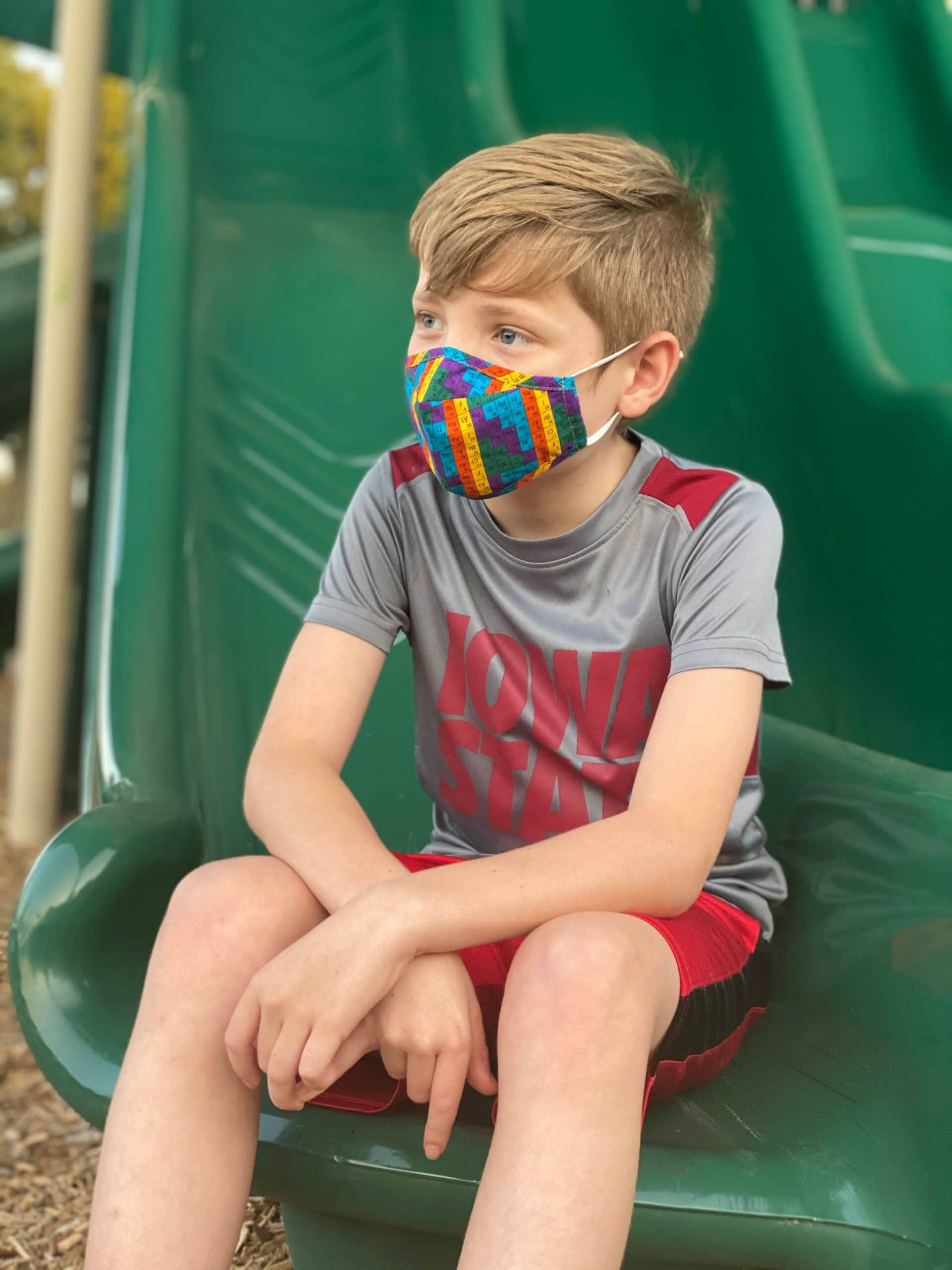 Boy modeling face mask from beau ties