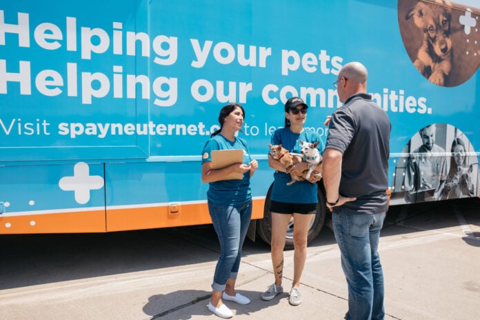 Spay neuter volunteers with mobile truck