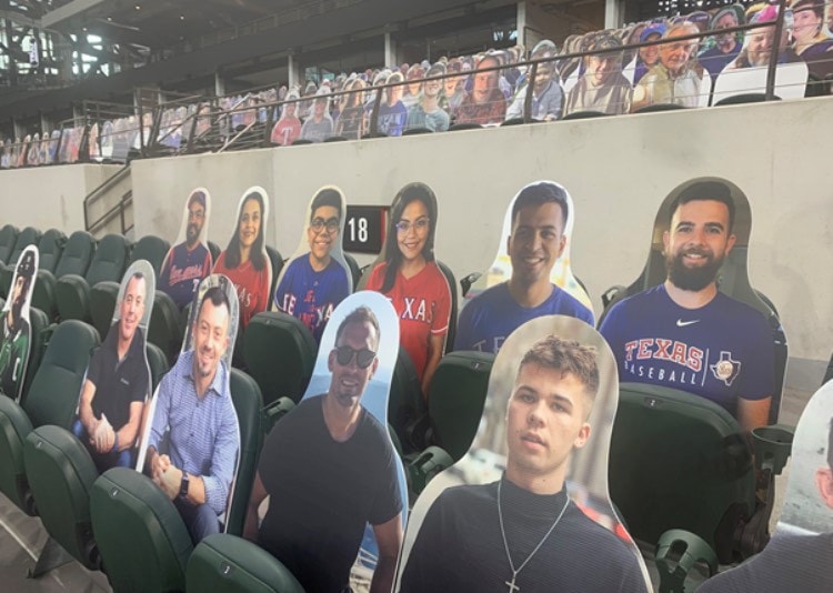 cutouts of kids at Rangers game