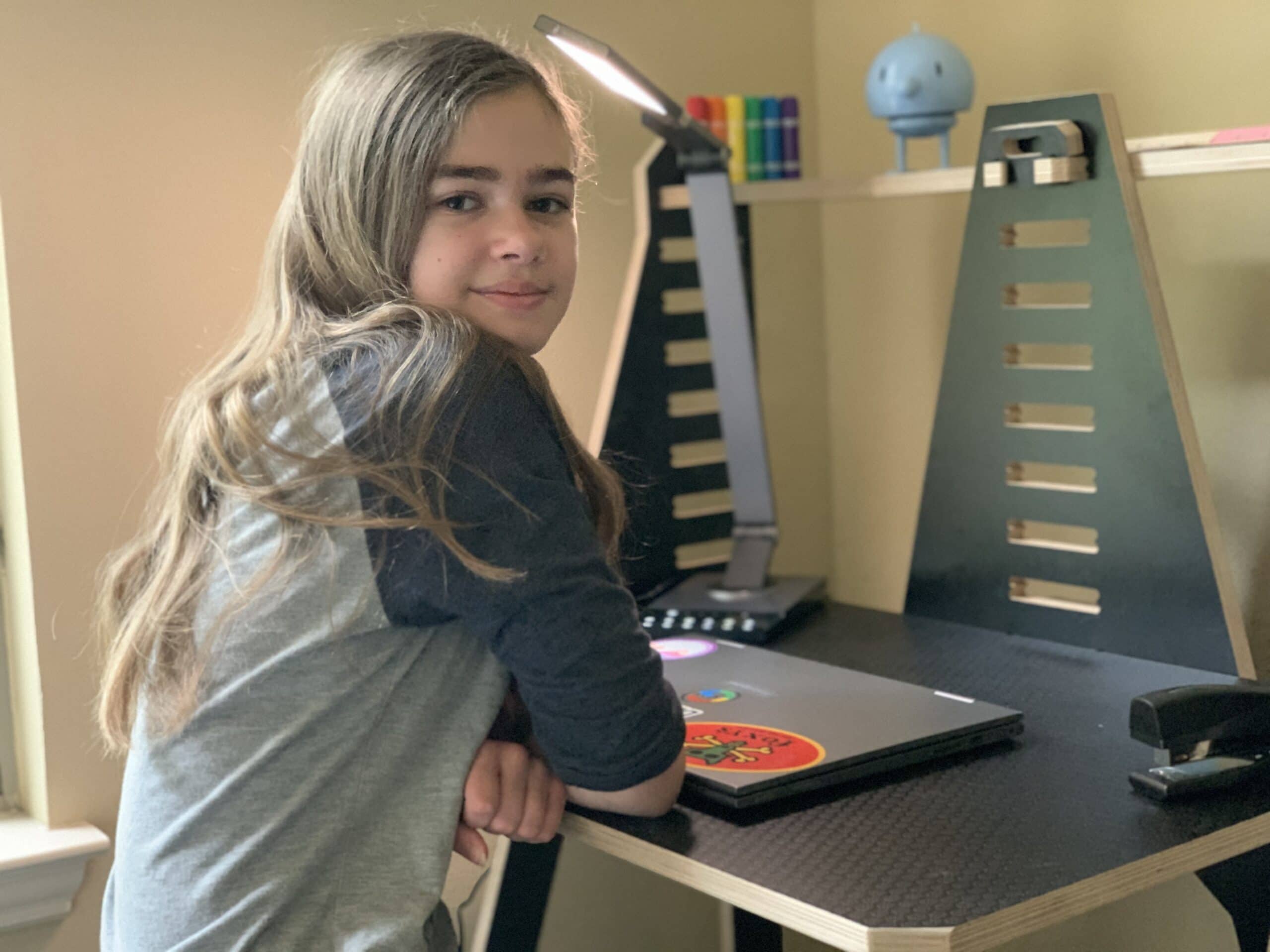 Girl sitting at work from home desk