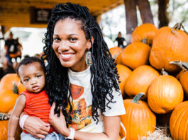 woman with child and pumpkins