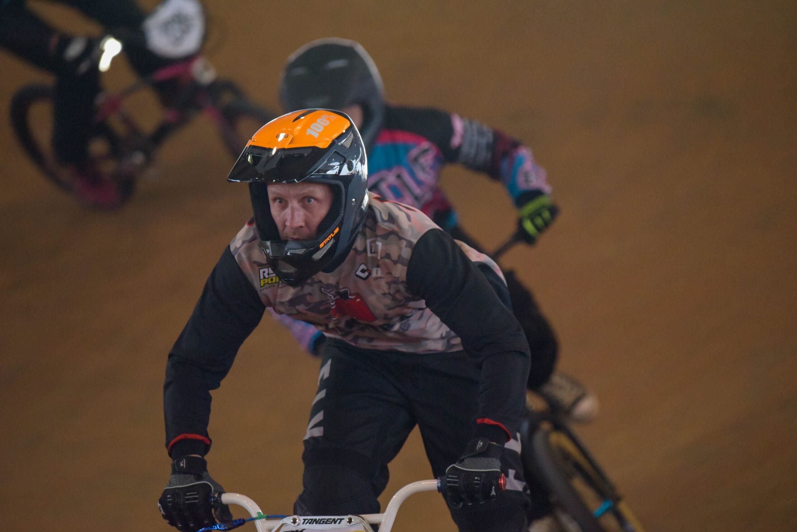 Man with helmet on BMX bike