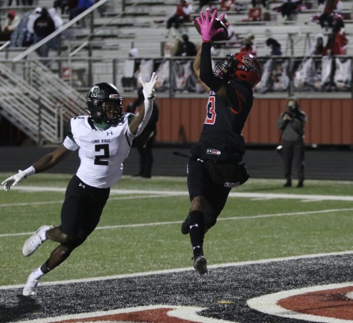 Cedar Hill senior wide receiver Javien Clemmer catches a second half touchdown pass during Friday's victory over Mansfield Lake Ridge. cedar hill football team
