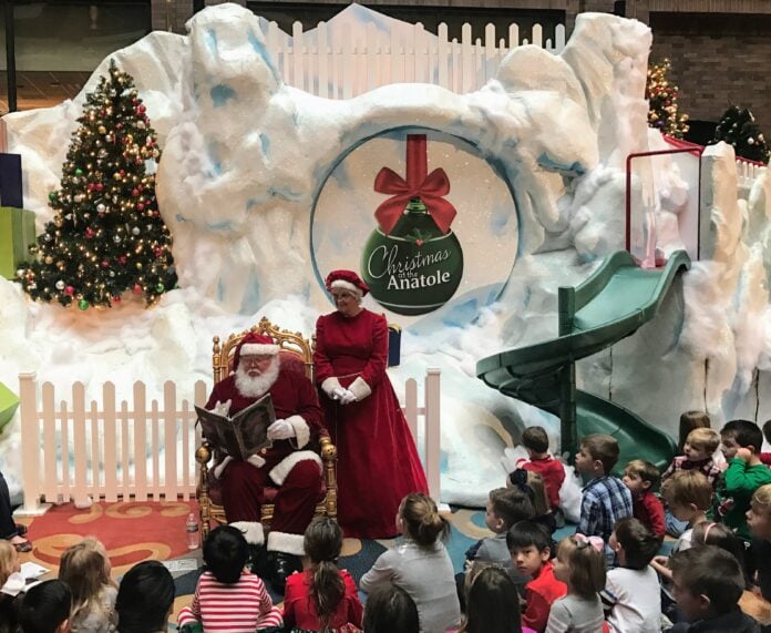 Santa reads a story to children