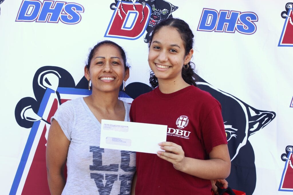 Duncanville ISD receives technology donation, distributes checks