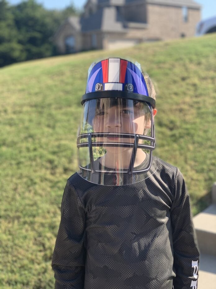 Boy wearing face shield