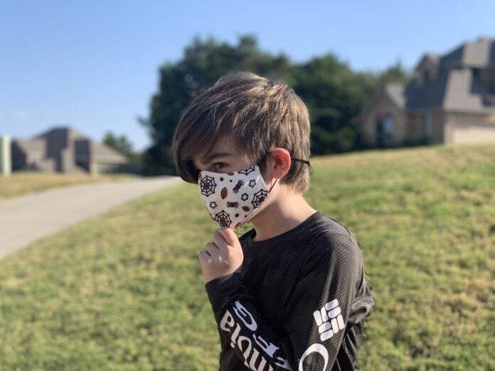 Boy wearing Halloween mask