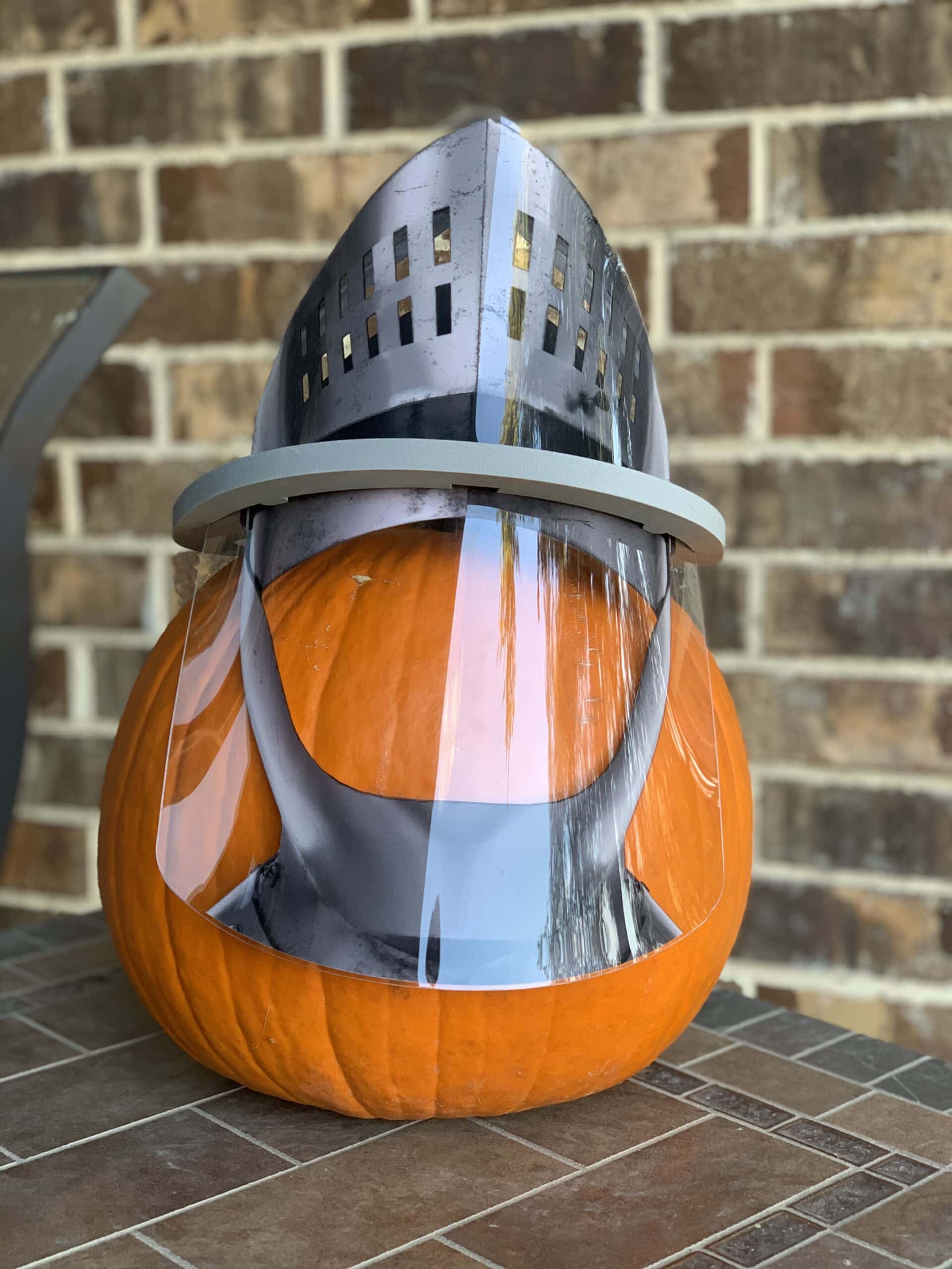 pumpkin wearing a viking face shield