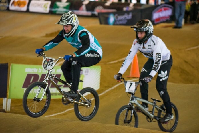 Man and boy on BMX bikes