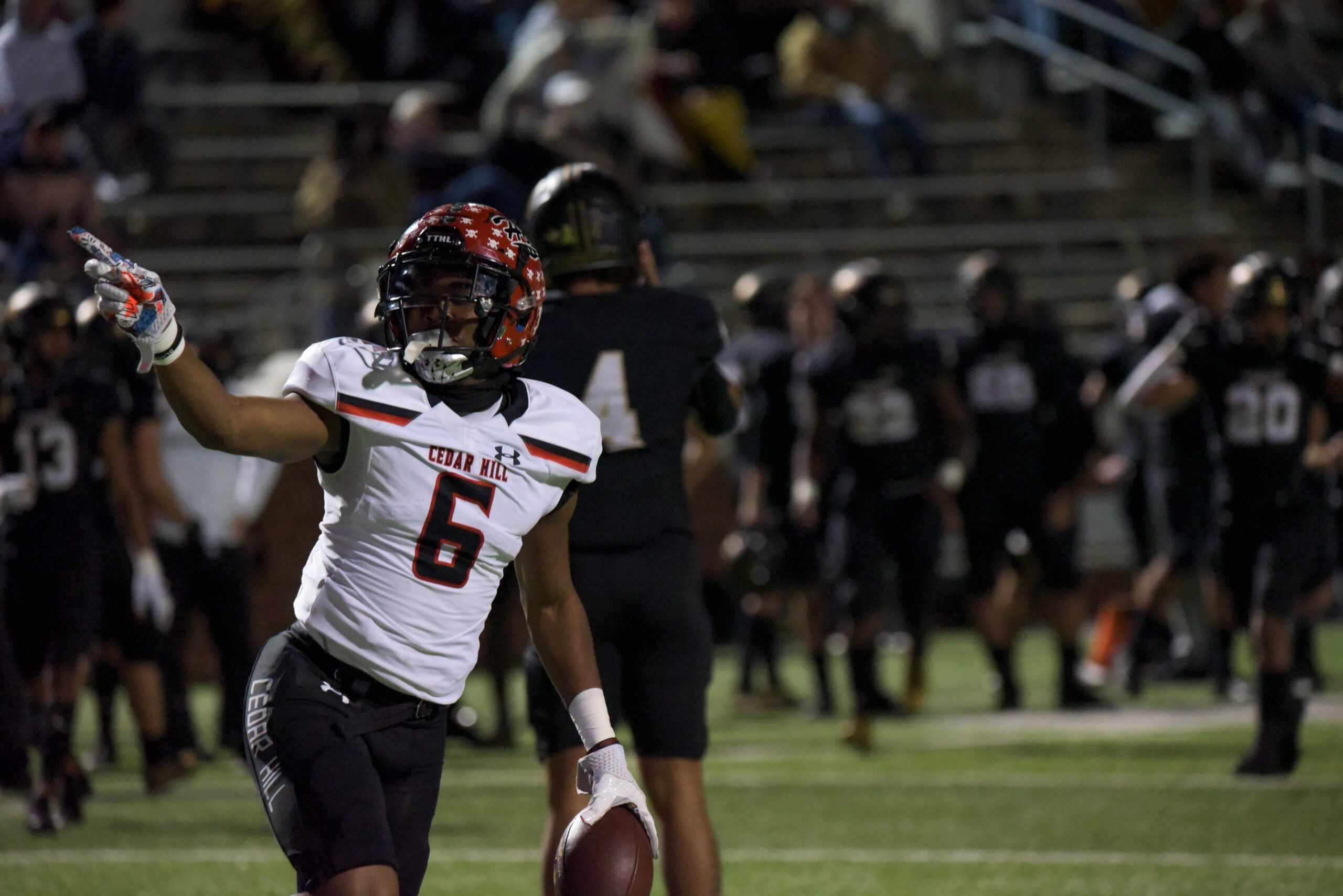 Brett Lynch celebrates as he intercepts the ball from the Mansfield quarterback