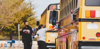 Life High Waxahachie NHS Students Kickoff Giveback Initiative With Bus Wash school bus
