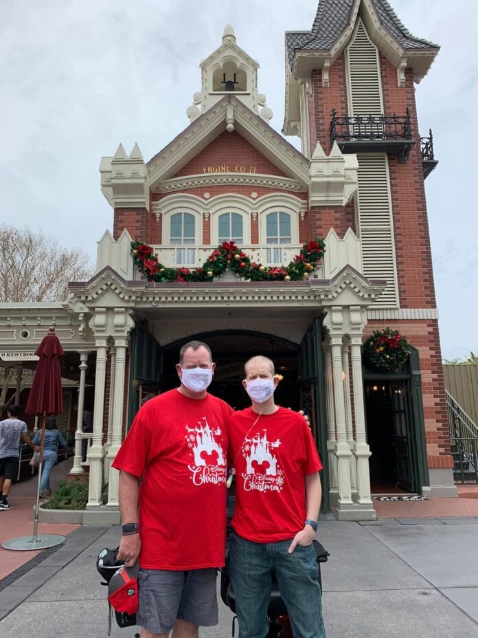 Brandon Peterson guys in front of Disney World fire station