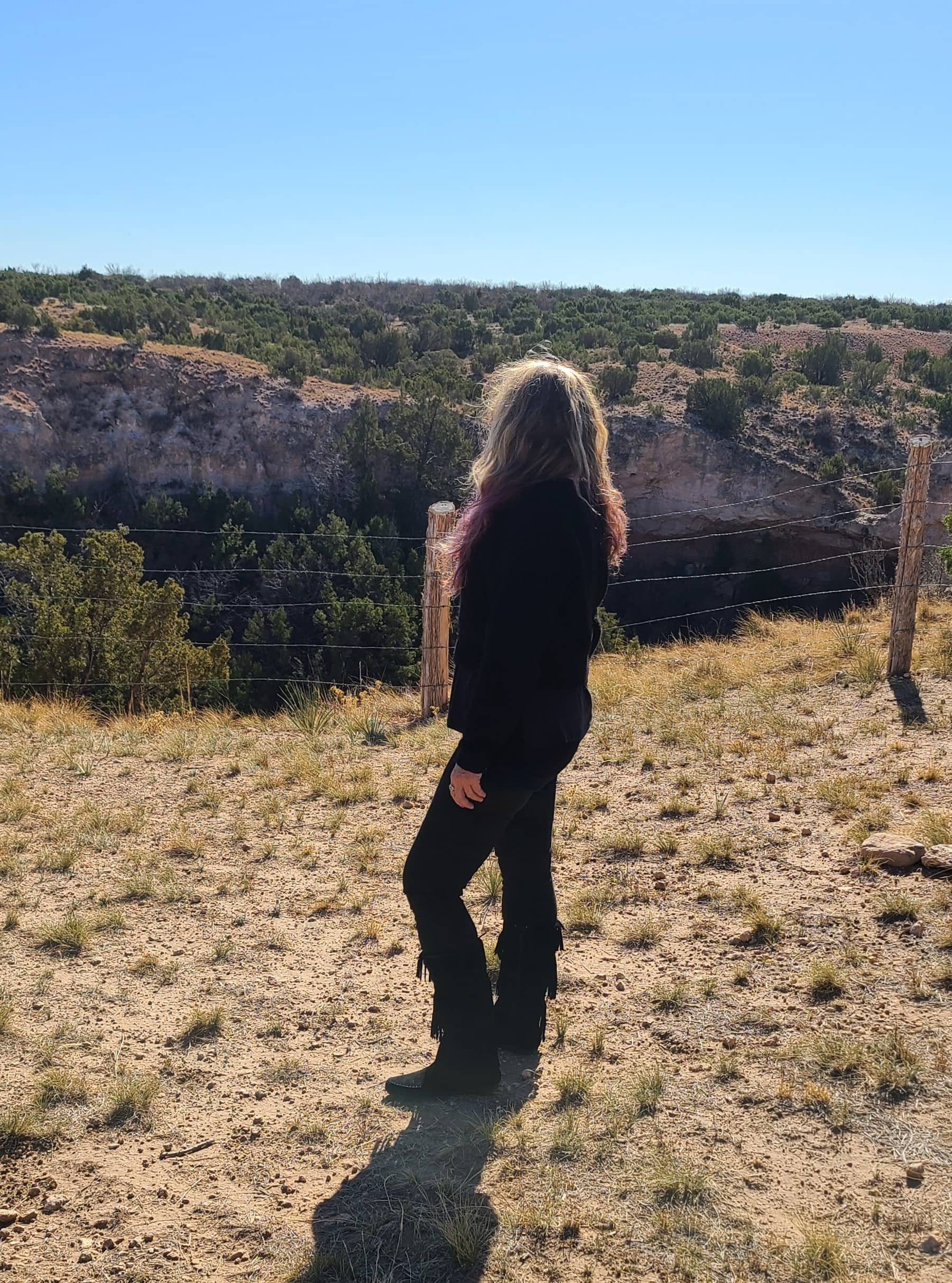 lady standing by canyon