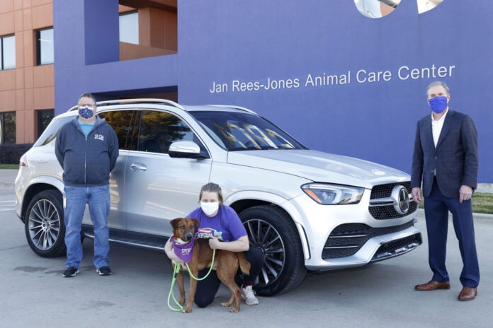 SPCA Avondale people with dog and SUV