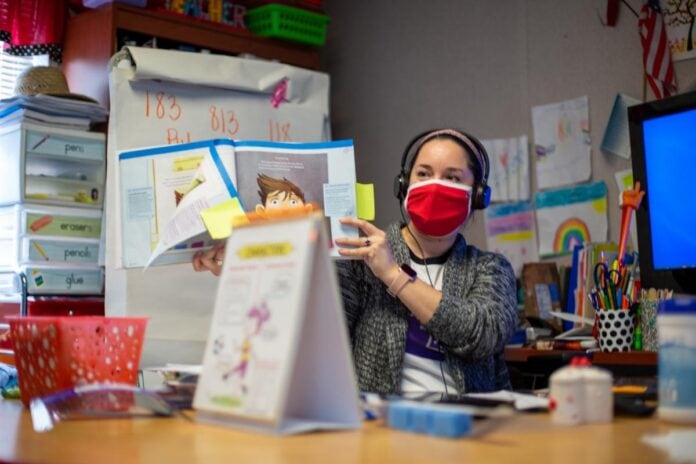 Harmony Teacher Benefits Teacher wearing a mask