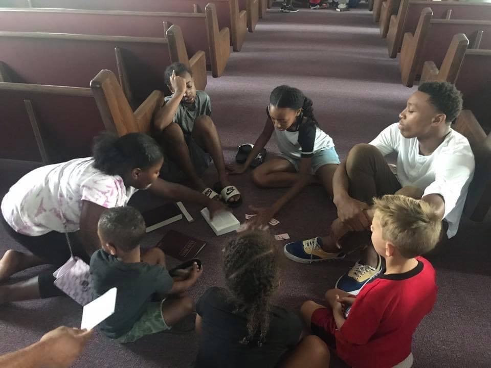 group of children sitting in a circle