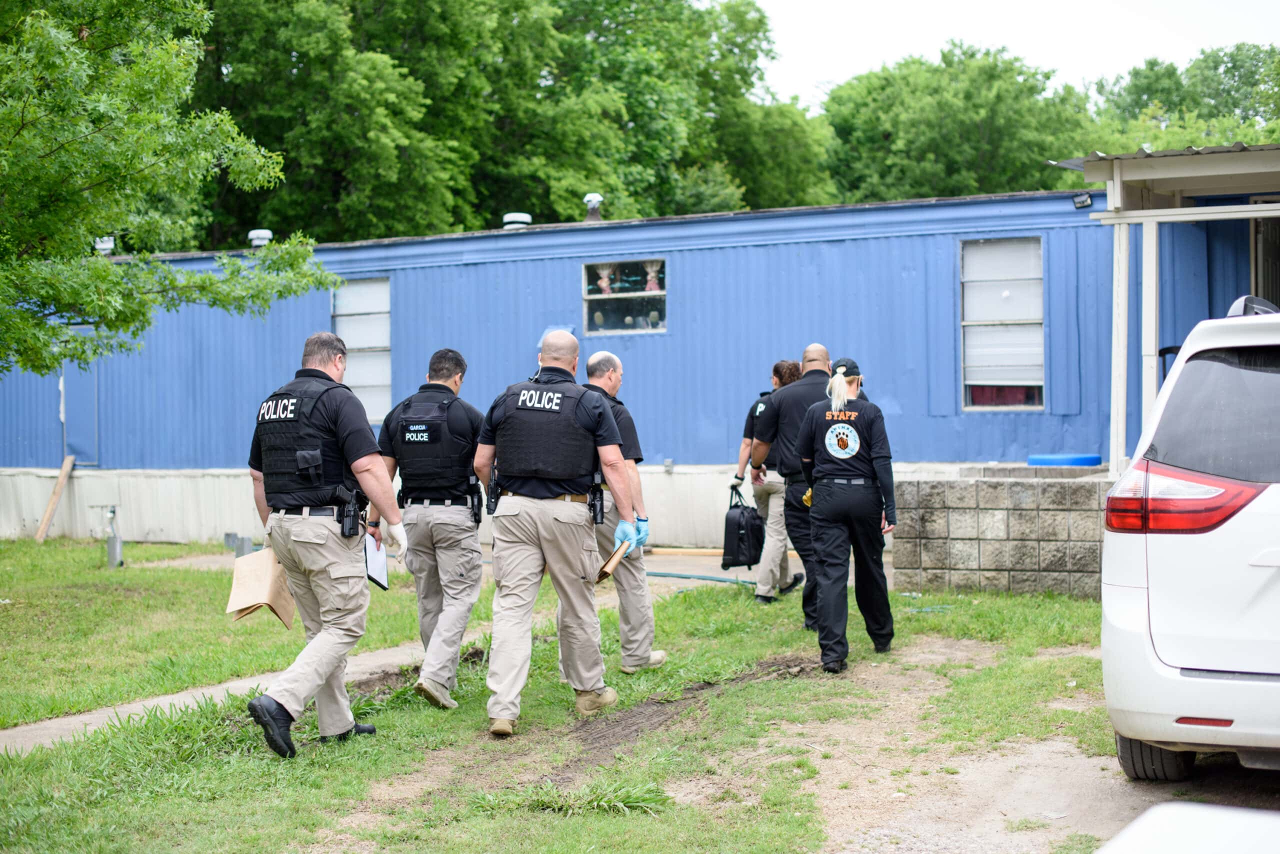 police approach home