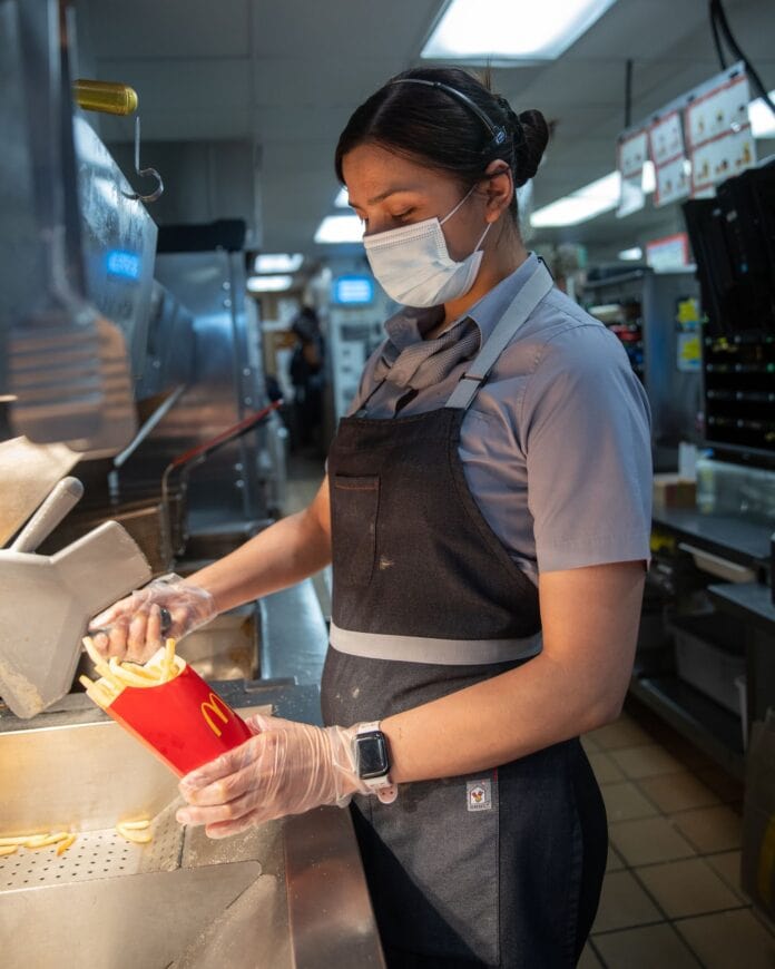 lady serving french fries